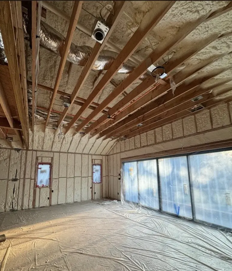 Interior walls and ceiling insulated with spray foam during new construction in Ward